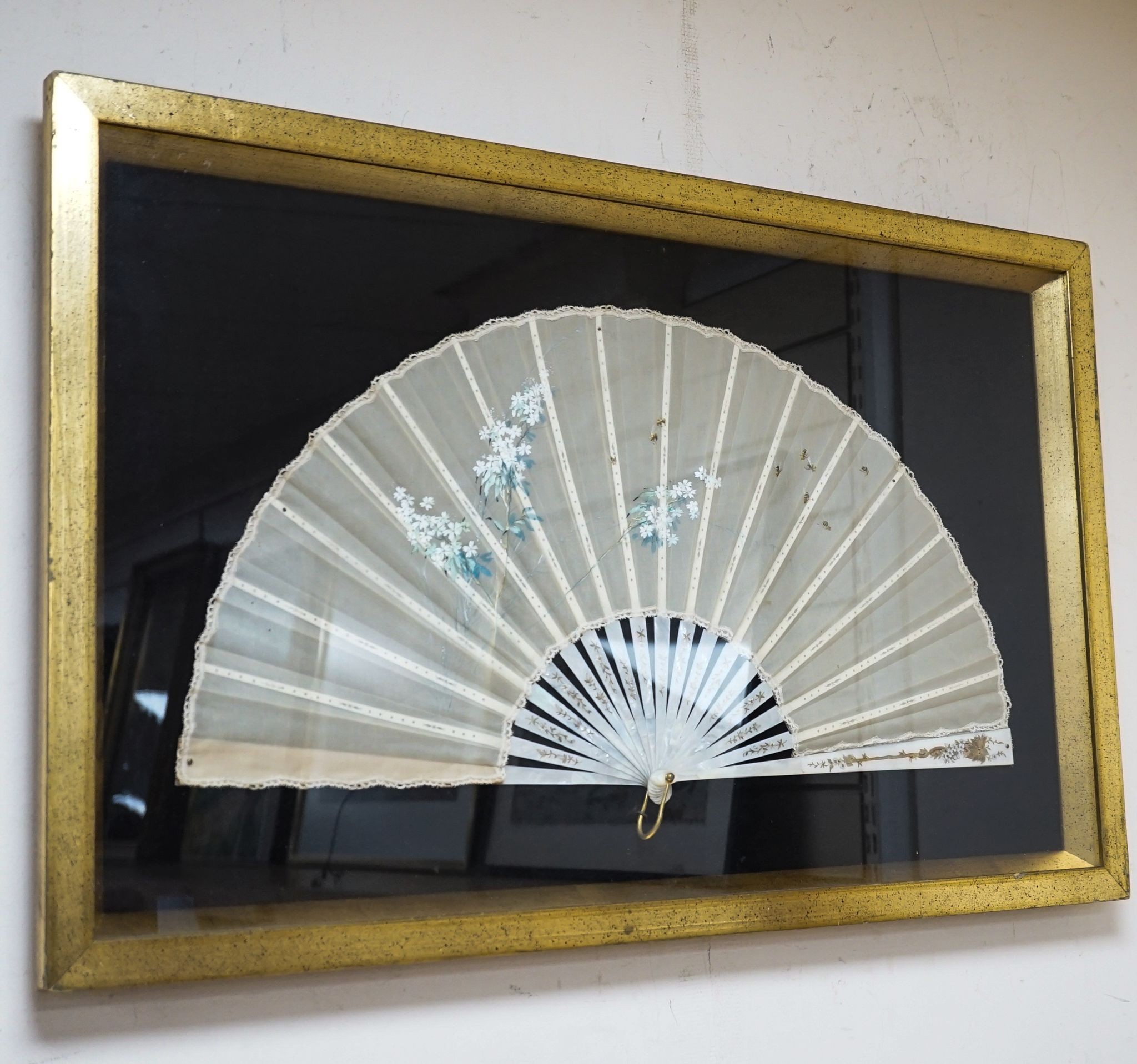 A framed 19th century French mother of pearl and painted silk fan, approx. 60cm long excl frame